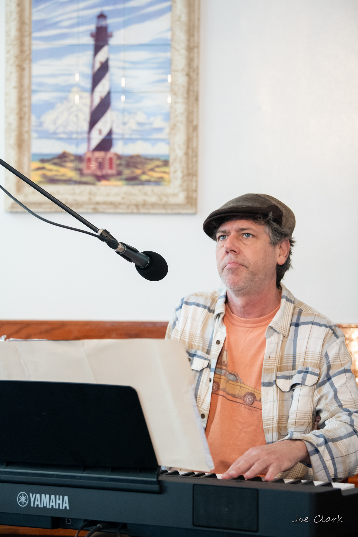 Christopher playing piano at Toucan